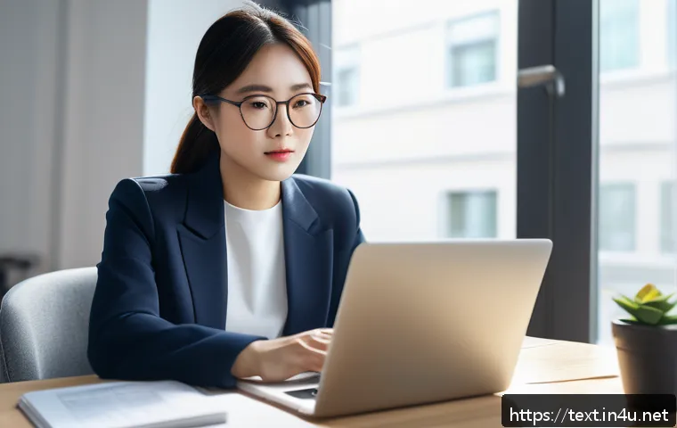 섬유기사와 직장 내 커뮤니케이션 - A professional office scene showing a focused adult woman studying online for a certification exam o...